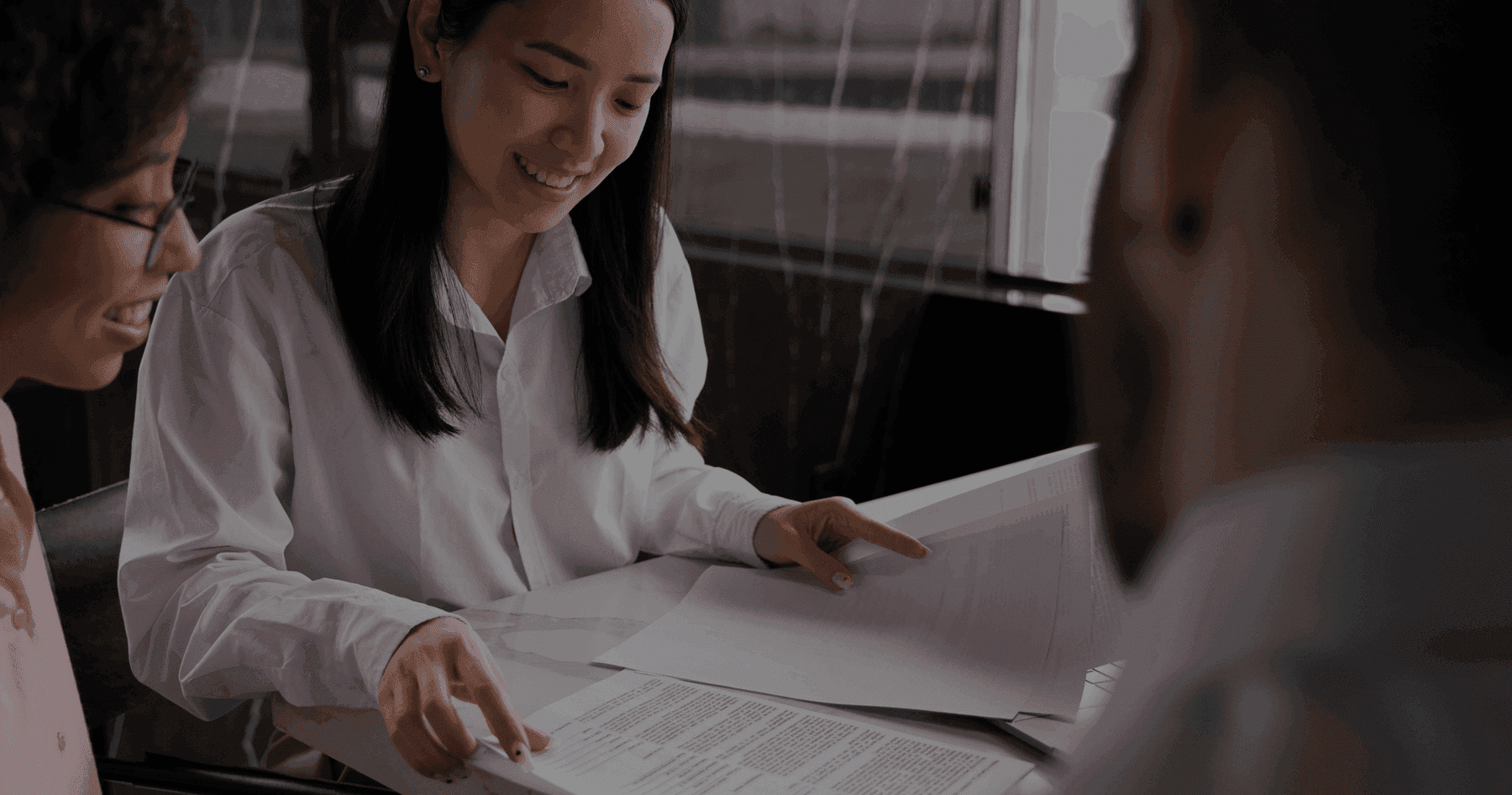Japan transaction team reviewing a document set together