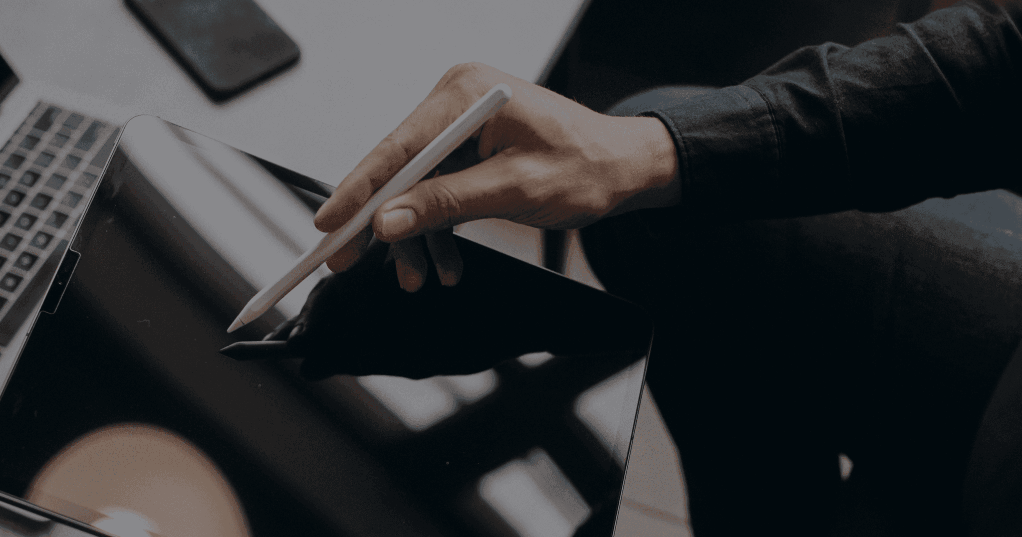 A professional reviewing transaction information on a tablet
